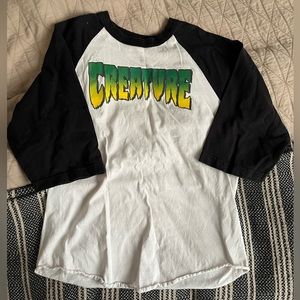 Creature baseball tee